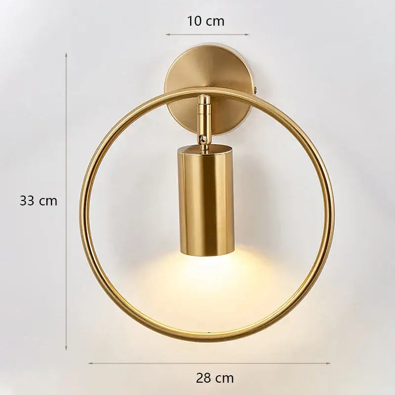 Modern minimalist wall lamp with gold-toned circular frame and glass shade gold for bedroom lighting