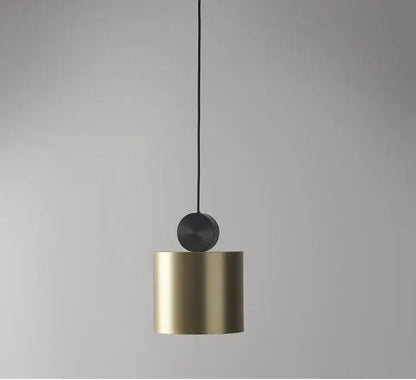 Modern minimalist golden led pendant light with cylindrical brass body and matte black top for dining room decorbites pendant light