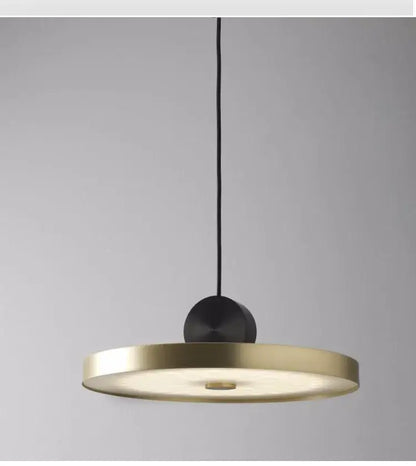 Modern minimalist gold and black led pendant light with sleek circular shade and matte suspension for dining room decorbites golden led
