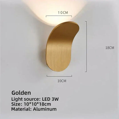 A sleek golden aluminum led wall lamp with a modern curved design for living room lighting