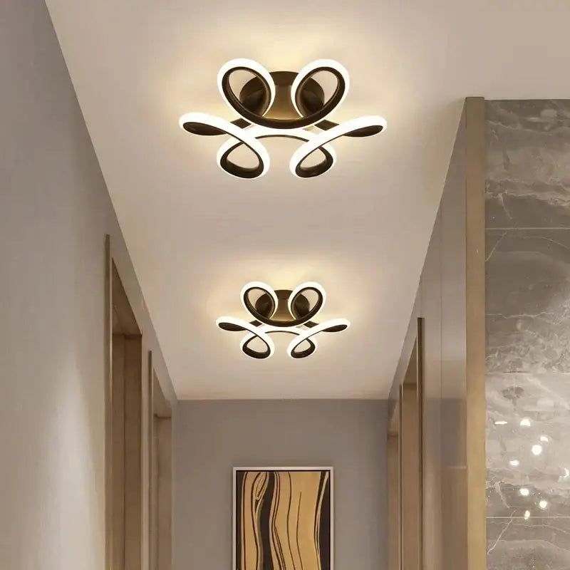 Modern minimalist gold led ceiling light with sleek curved arms and glowing white illumination for living room decorbites led ceiling
