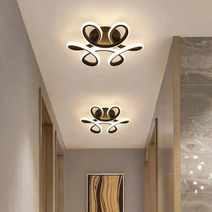 Modern minimalist gold led ceiling light with sleek curved arms and glowing white illumination for living room decorbites led ceiling