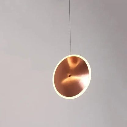 Modern minimalist copper-colored gold led pendant light with sleek design and softly glowing edge for kitchen island decorbites gold led