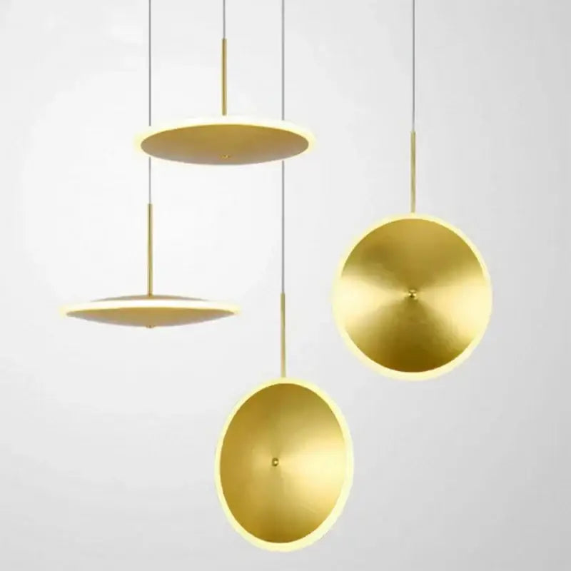 Modern minimalist gold led pendant light with sleek circular discs suspended by thin rods for kitchen island decorbites decor