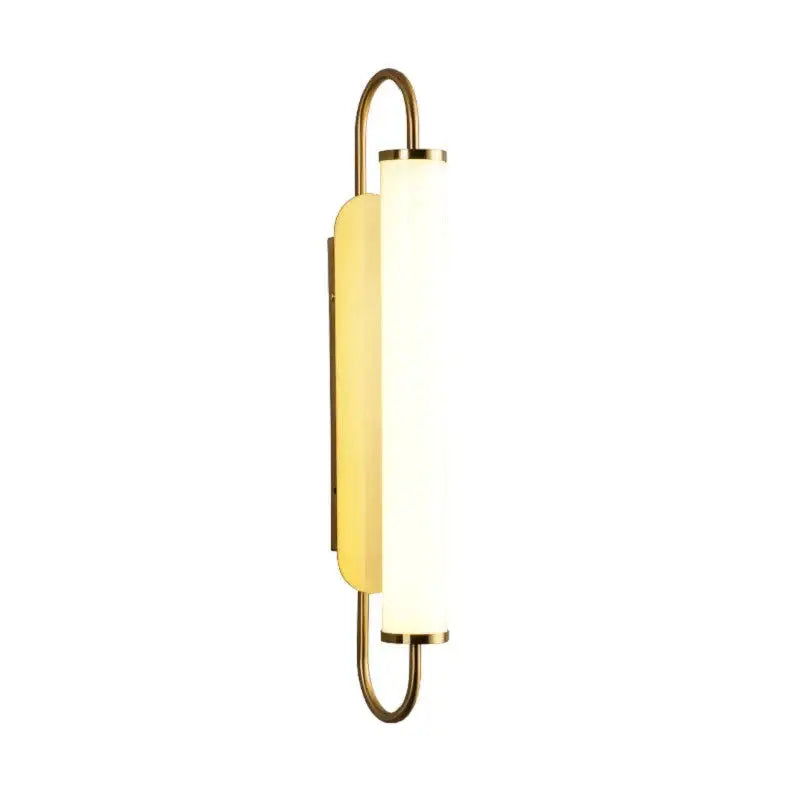 Gold-toned modern minimalist led wall lamp with frosted glass cylinder and curved metal frame for bedroom use