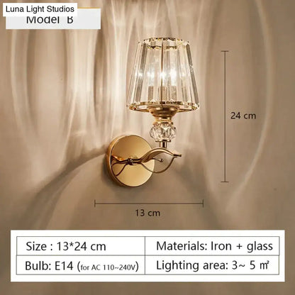 Modern minimalist gold wall lamp with faceted crystal shade and decorative glass elements for bedroom lighting