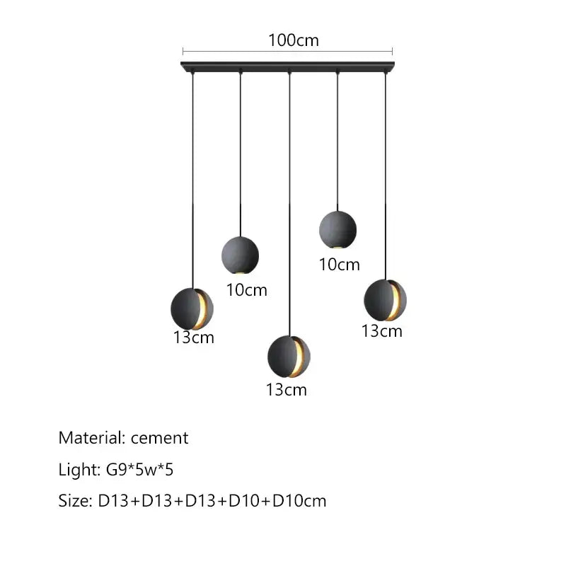 Modern minimalist gray and gold pendant light with black spherical matte finish and gold accents by decorbites cement planet chandelier