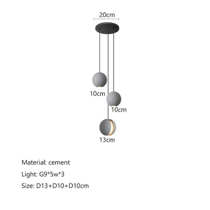 Modern minimalist pendant light with three matte gray cement planet chandelier shades by decorbites for dining room decor
