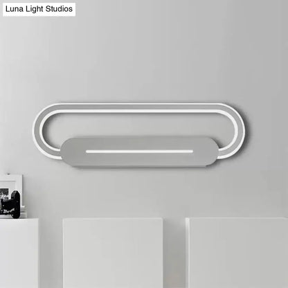 Modern minimalist gray acrylic oval led wall sconce with two concentric rings and central illuminated bar for bedroom lighting
