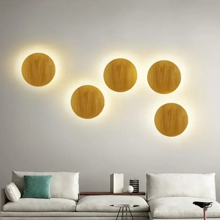 Five circular modern minimalist led wooden wall lights with warm glowing backlight for living room decorbites led wooden decor