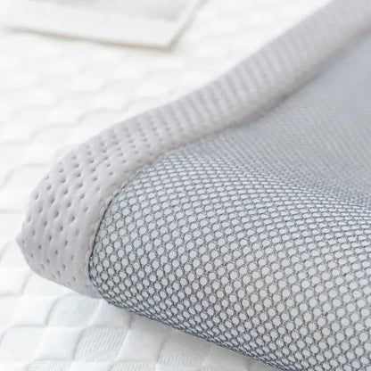 White mesh pillowcase with breathable perforated texture and grayish undertones for modern minimalist green sofa mat