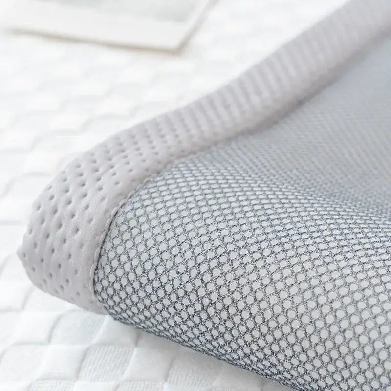 White mesh pillowcase with breathable perforated texture and grayish undertones for modern minimalist green sofa mat