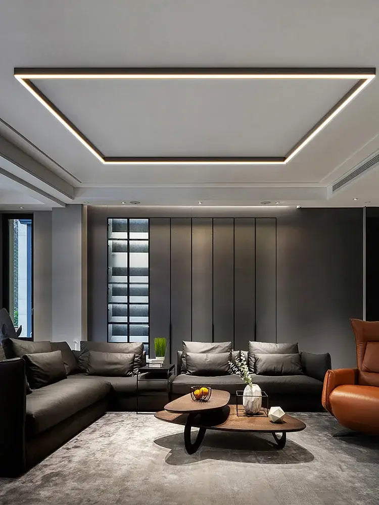 Modern minimalist coffee table with sleek dark wood top and black metal legs complements decorbites led ceiling lamp