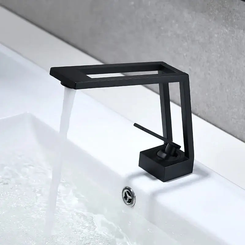 Modern minimalist matte black brass basin faucet with rectangular spout and decorbites black brass basin design