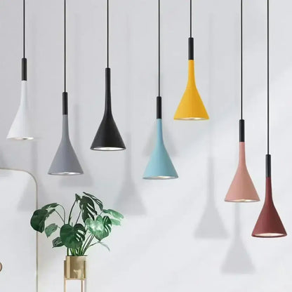 A modern minimalist multicolor metal pendant light set with matte finish and black cords for kitchen use