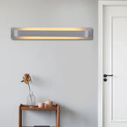Modern minimalist silver linear wall lamp with sleek metallic finish and warm even illumination for living room use