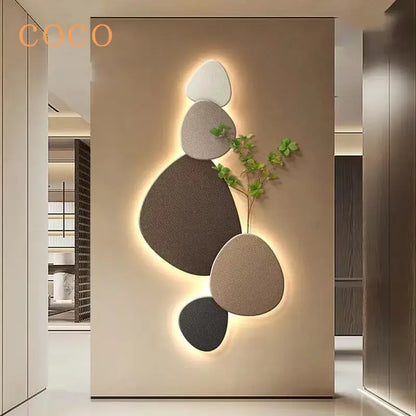 Modern minimalist wall lamp with five textured stone panels in white gray beige and black featuring decorbites green plant mural