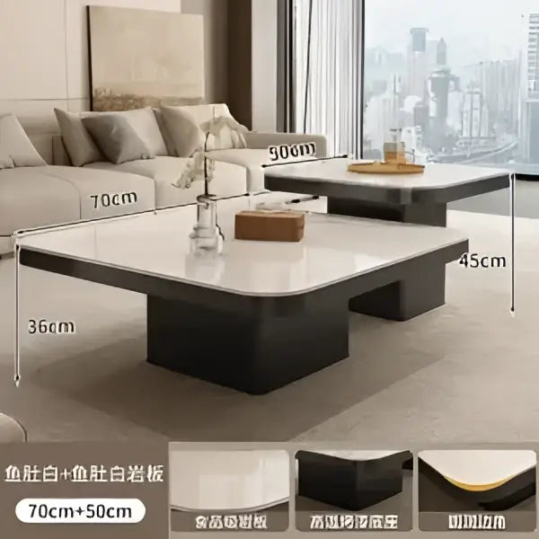 Modern minimalist coffee table set with a white marble top and black base featuring clean lines for living room use