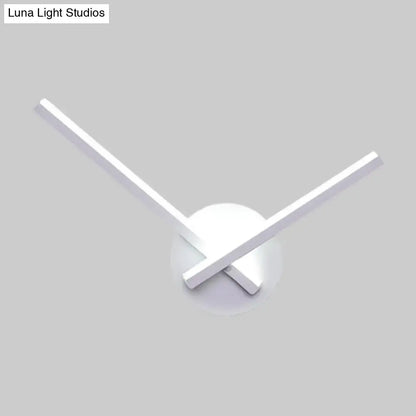 Modern minimalist white ceiling light with sleek arms and circular base featuring direct wired electric design