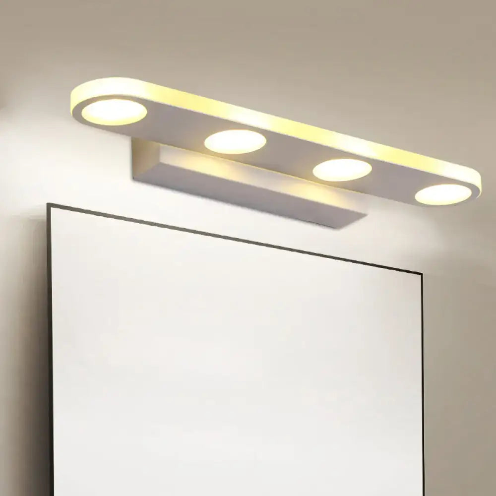 Modern minimalist white finish vanity light with acrylic shade and four bulbs supporting maximum bulb wattage for bathroom use