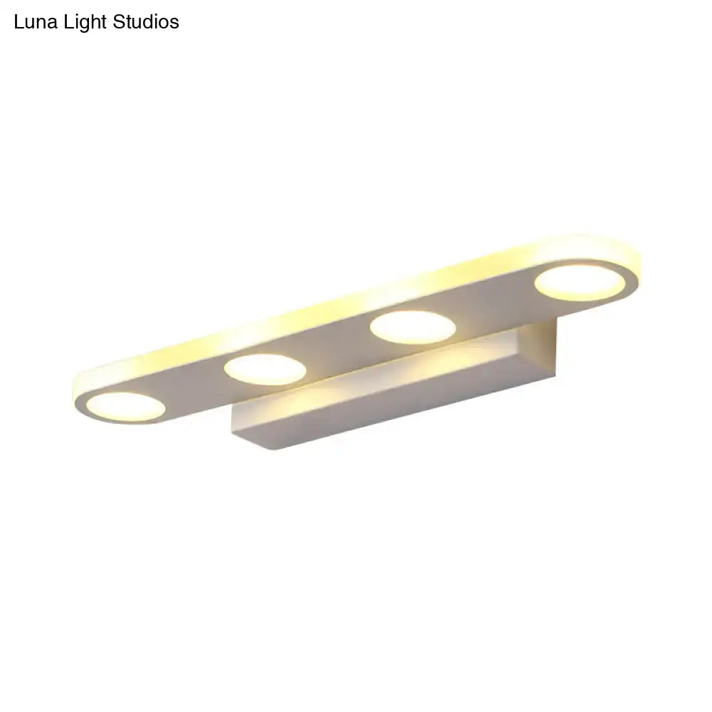 Modern minimalist white finish acrylic shade vanity light with three circular bulbs for maximum bulb wattage in bathroom