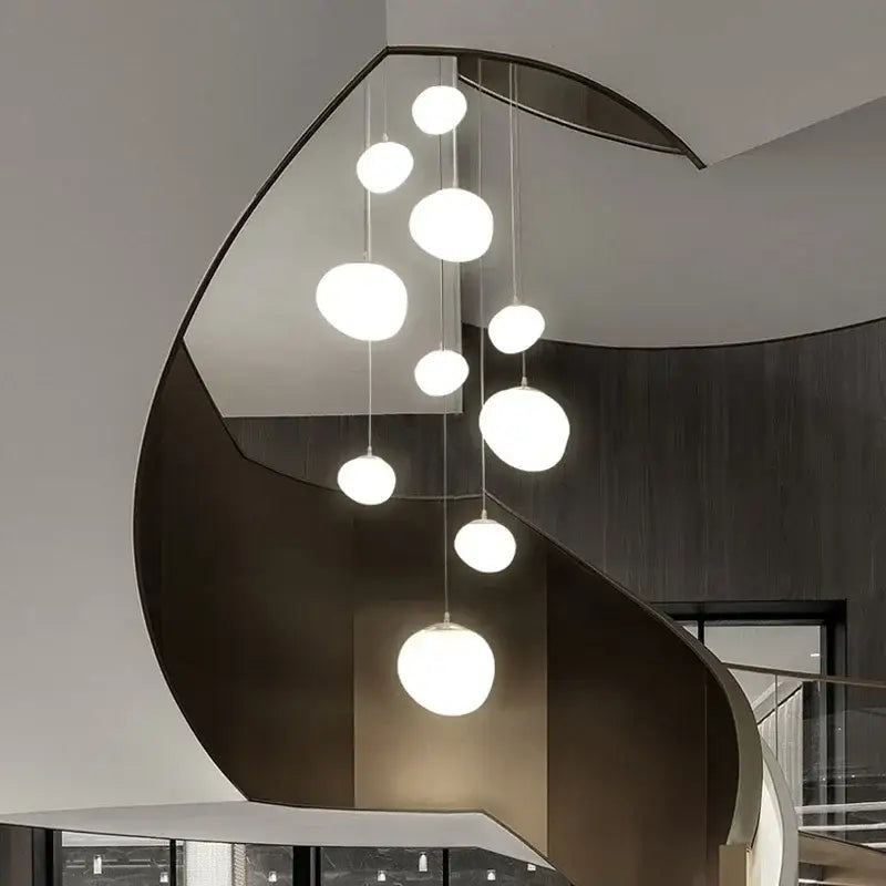 Modern minimalist white glass ball led pendant lights hanging in a cascading arrangement for living room decorbites glass ball
