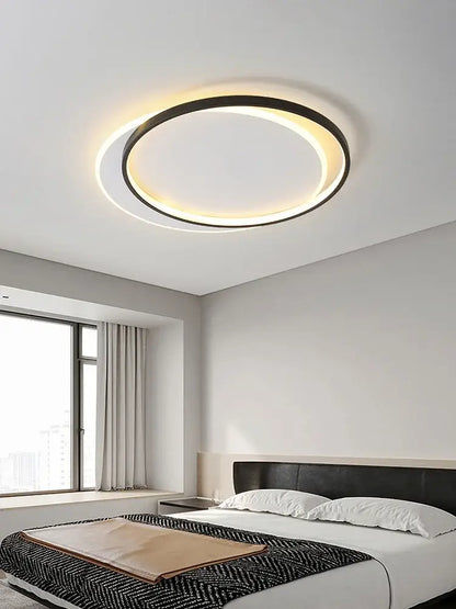 Modern minimalist white led ceiling lamp with black outer ring and warm white glow for bedroom ambient light decorbites led ceiling