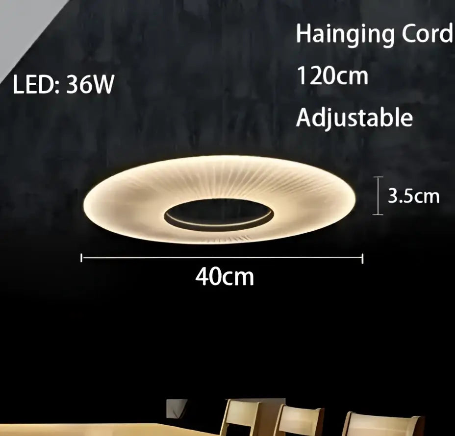 A modern minimalist white led pendant light with a circular warm glow and radial design for bedroom use