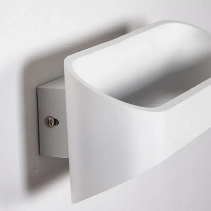 Modern minimalist white led wall lamps with sleek curved design and matte finish ideal for bedroom and living space lighting
