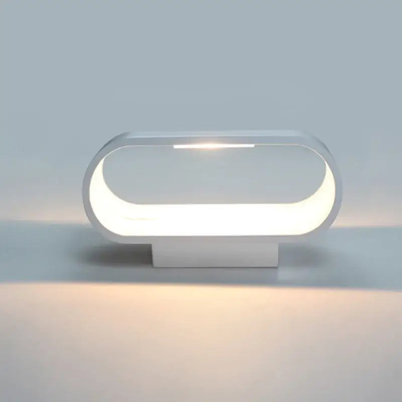 Modern minimalist white led wall lamps with sleek oval design for bedroom and corridor lighting use