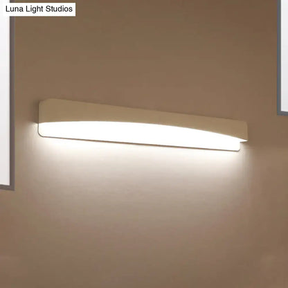 Modern minimalist off-white rectangular wall sconce lamp with sleek design and soft diffused lighting for bedroom use