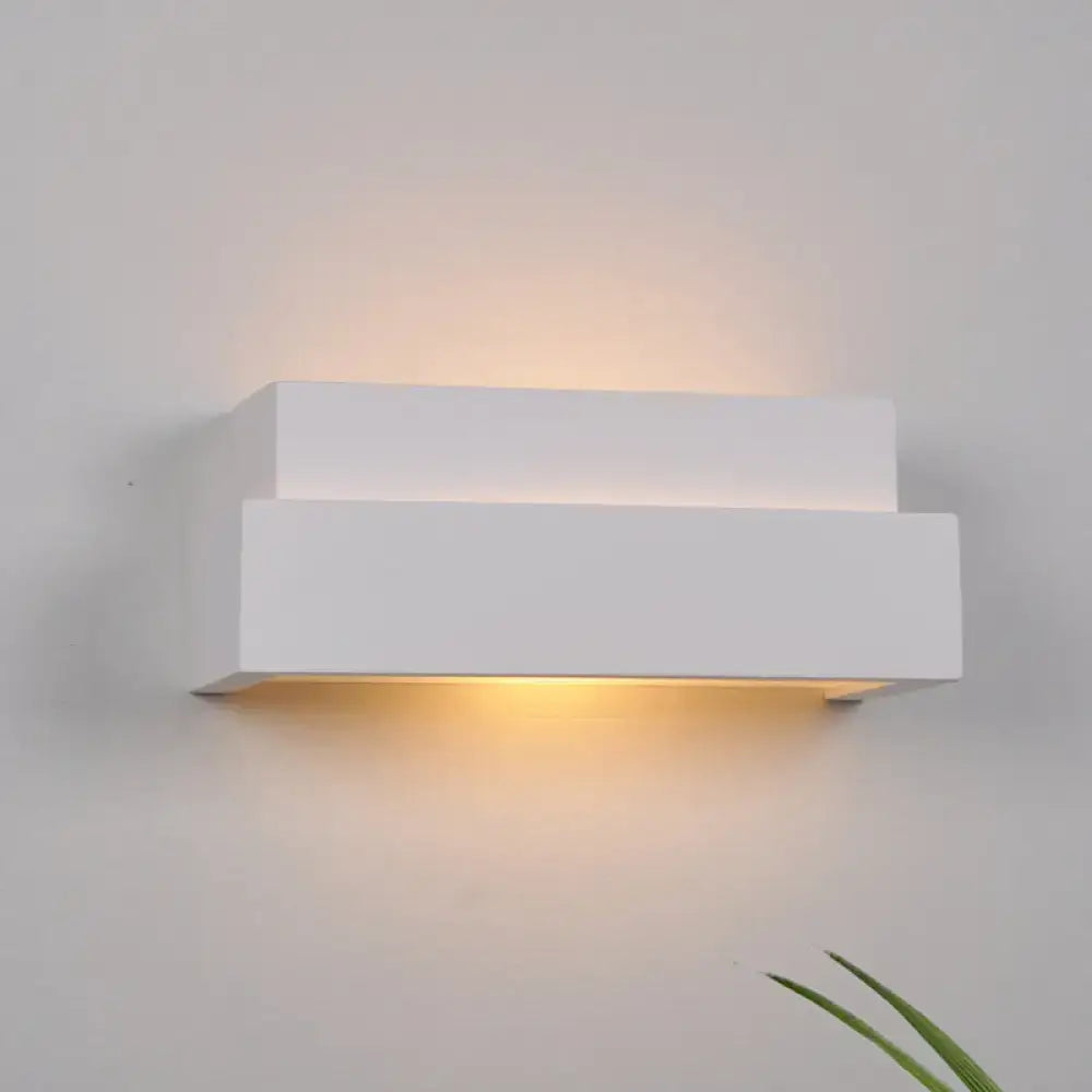 Modern minimalist white rectangular wall washer light with sleek design emitting warm ambient light for bedroom use