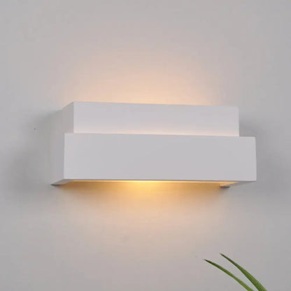 Modern minimalist white rectangular wall washer light with sleek design emitting warm ambient light for bedroom use
