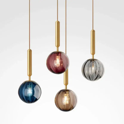 Modern multi color glass pendant light with painted iron finish featuring five brass rods and blue, burgundy, gray, amber, clear globes