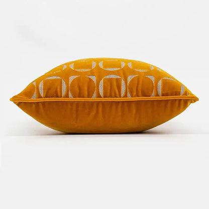 A plush mustard-yellow velvet pillow cover with silver geometric jacquard motifs for modern living room decorbites