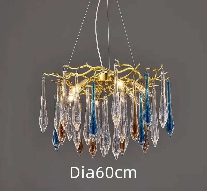 A modern nest crystal led chandelier with golden branch frame and clear blue amber glass pendants for living room