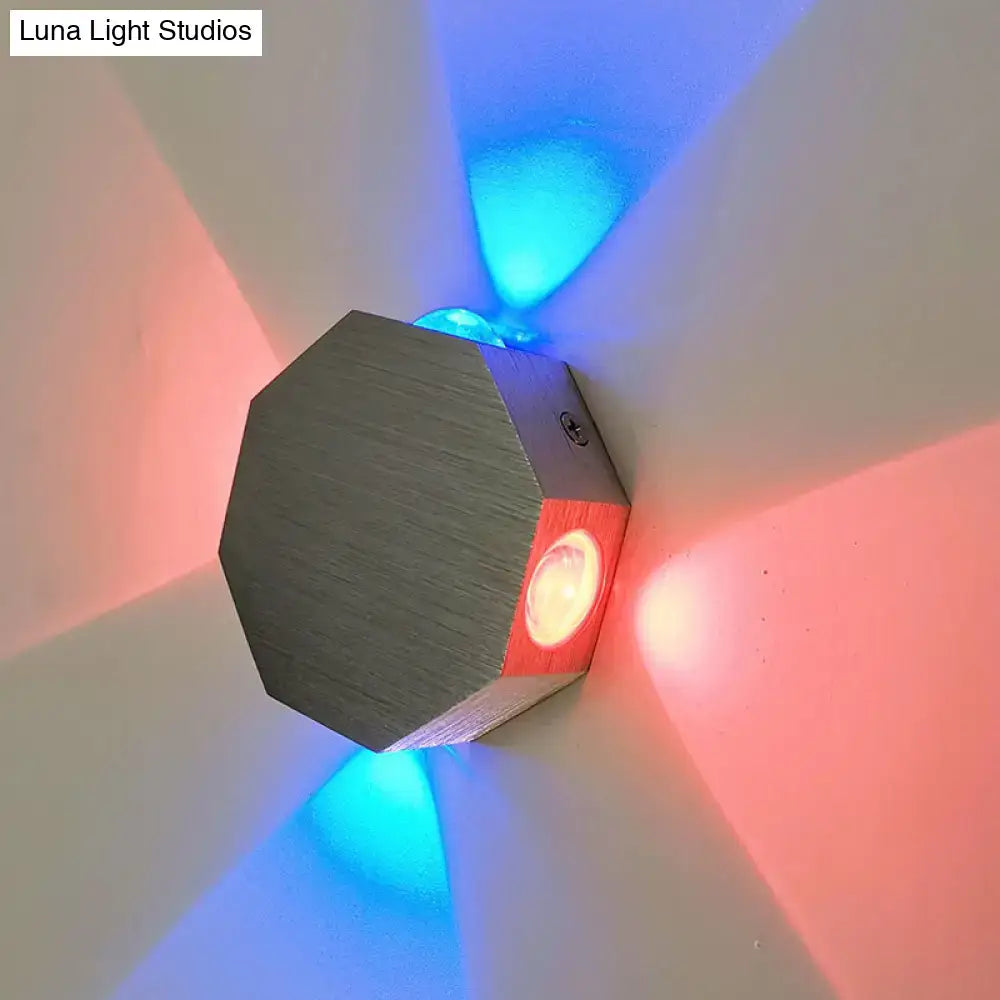 Modern octagonal wall sconce with nickel finish, wood accents, and built-in led light emitting red and blue beams