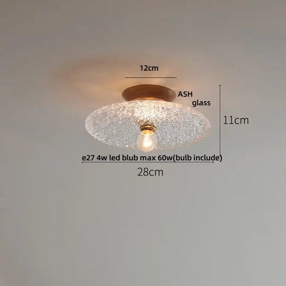 A warm-toned modern nordic ceiling lamp with decorbites clear glass led and brass-finished bulb holder