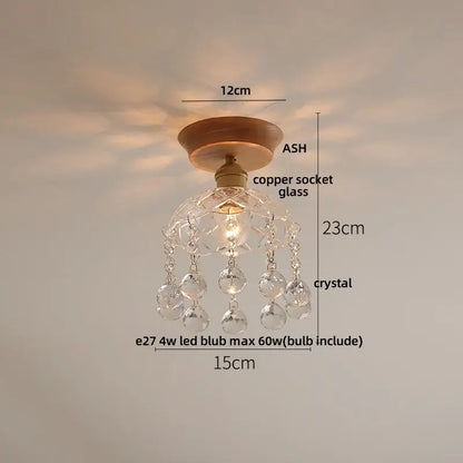 A modern nordic ceiling lamp with a warm wooden base copper socket and decorbites clear glass led beads