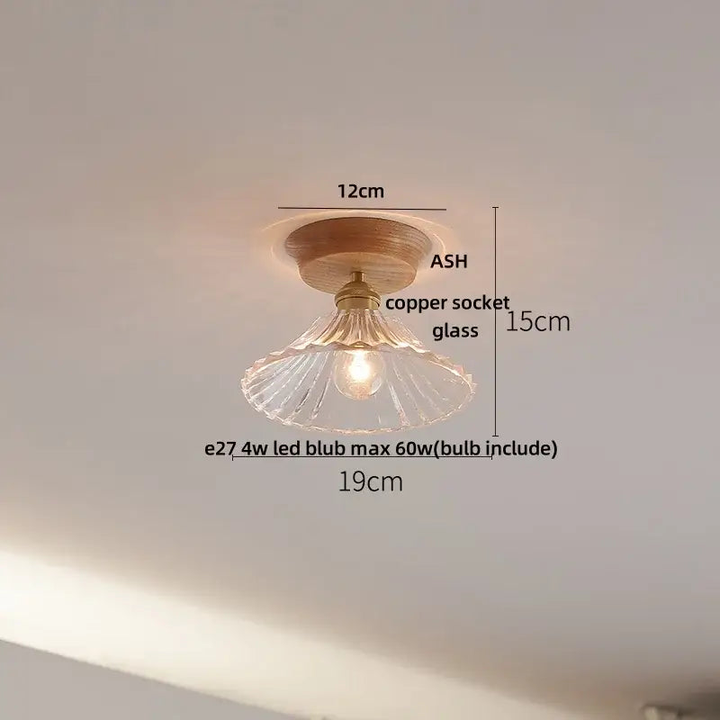 A warm-toned modern nordic ceiling lamp with wooden base and decorbites clear glass led fluted shade for kitchen