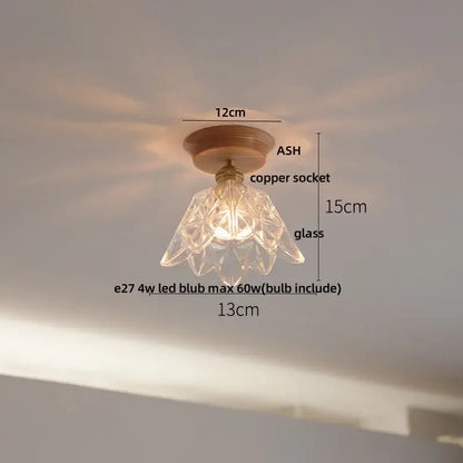 Modern nordic clear glass led ceiling lamp with faceted glass pendant, copper socket, and wooden base by decorbites