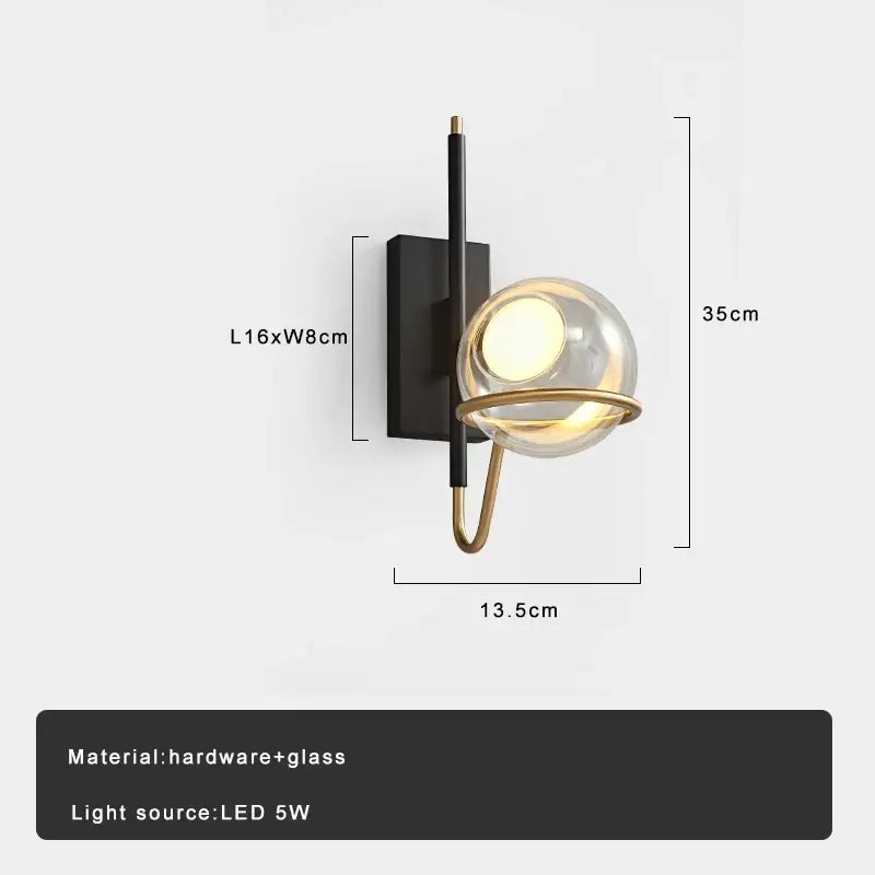 Modern wall sconce with sleek black hardware and gold-toned accents holding a decorbites clear glass ball pendant light