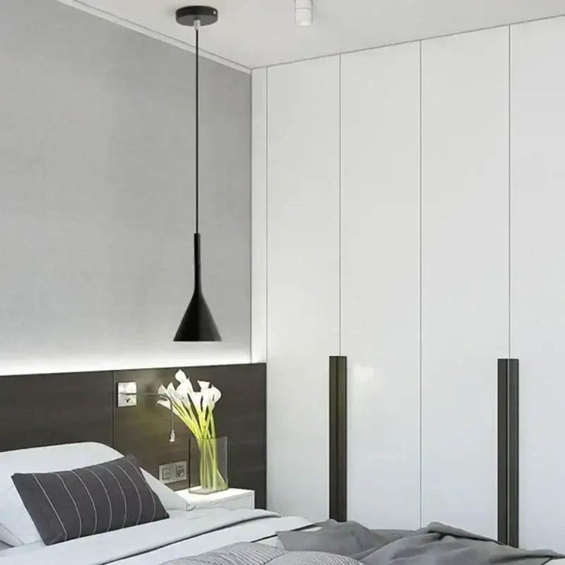 Modern nordic black metal pendant light with conical shape and sleek minimalist design for bedroom lighting