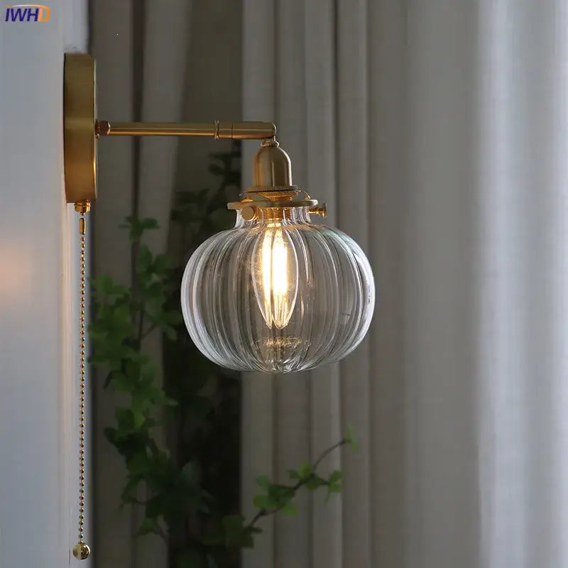Modern nordic brass glass ball wall lamp with ribbed clear glass globe and exposed filament bulb for bedroom decorbites glass ball