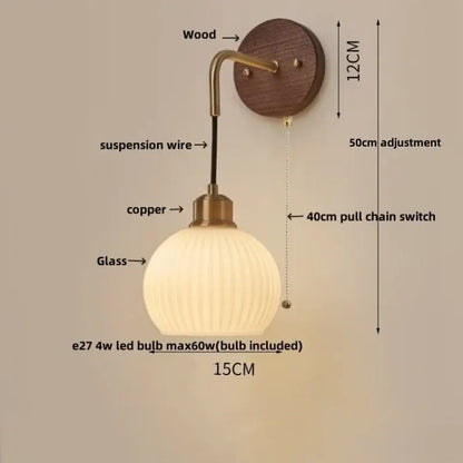 Modern nordic copper adjustable led wall light with warm-toned glass globe and brass-finished copper arm by decorbites copper adjustable