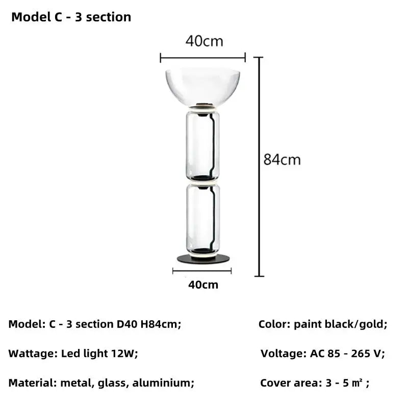 Modern nordic floor lamp with black and gold metal frame, clear glass shade led sections, and aluminum base for living room use
