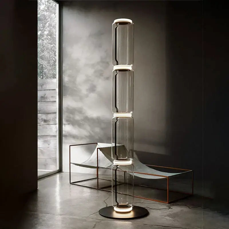 Modern nordic floor lamp with transparent glass shade led and stacked cylindrical glowing lights for living room use
