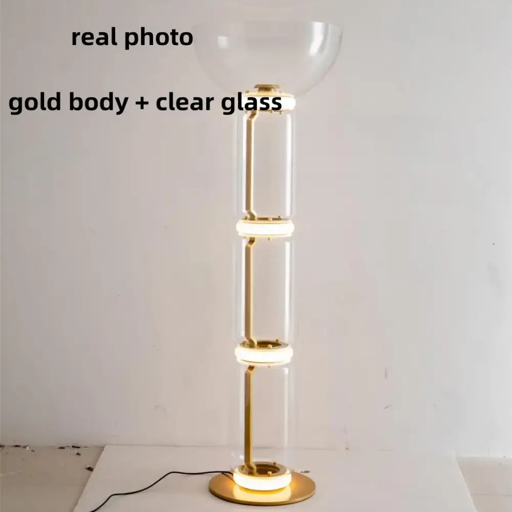Modern nordic floor lamp with gold-toned metal frame and clear glass shade led rings for living room lighting