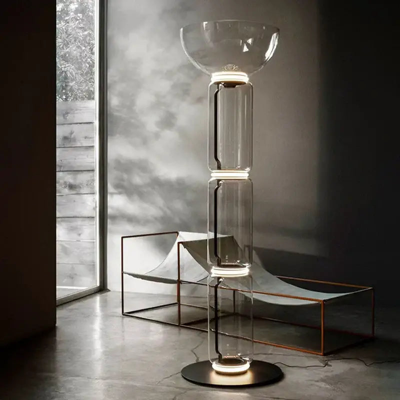 Modern Nordic floor lamp with stacked glass shade LED sections and glowing circular base for living room lighting