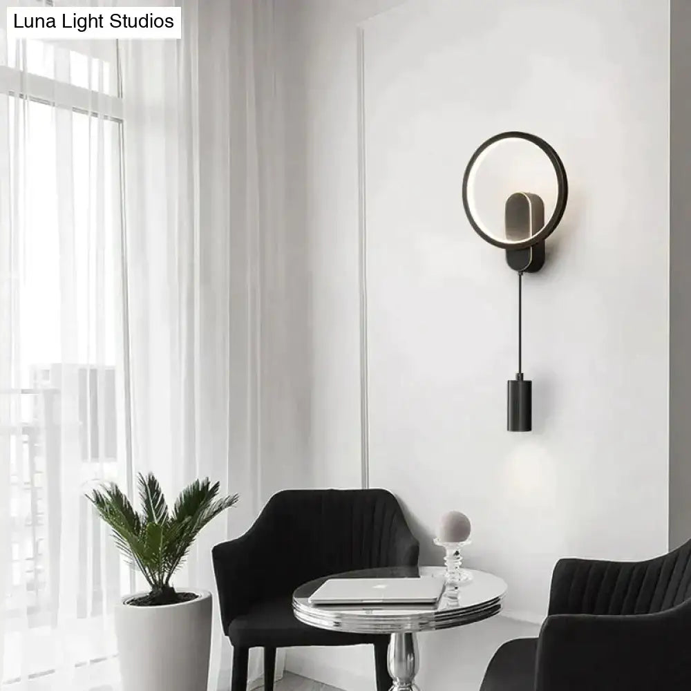 Modern nordic led wall lamp in black gold with a sleek circular wall sconce and hanging cylindrical pendant design